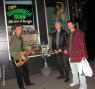 JOE BENDIK, BILLY FICCA and ROMAN hanging out in frontof OTTO's before their sets.