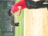 Mr. WOOD eating as he pitches batting practice.