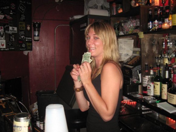 SHERRI behind the bar.