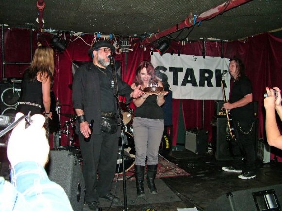 LANI & JOE play HAPPY BIRTHDAY while TINA holds the cake after Mr. WOOD blew out the candles.