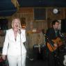 LYNNE VON sings while SIMON plays.