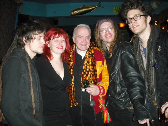 LEE "BLACK" CHILDERS flanked by SIOUX CITY PETE & THE BEGGARS.