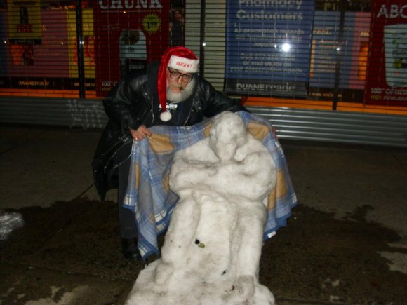 Mr. WOOD puts blanket on Homeless Snowman.