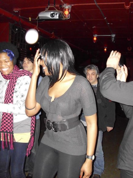 THE VIOLENCE fans (CHERIE and KITANA) dance while Birthday Boy CRAZY GLENN lurks in the background.