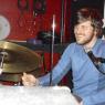 STEVE moves to the drums,