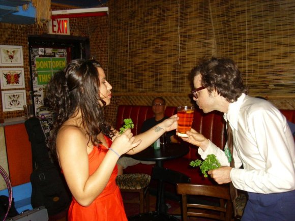 JASON drinks from NOEL's glass after schmoozing her with parsley.