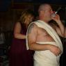 LYNN VON pinning on PHILTHY PHIL's Toga!