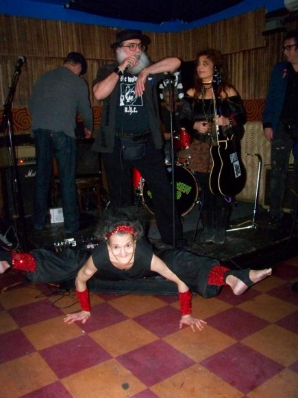 REW watches Mr. WOOD as he tries to not look as THE AMAZING AMY stands on her hands while doing a split!