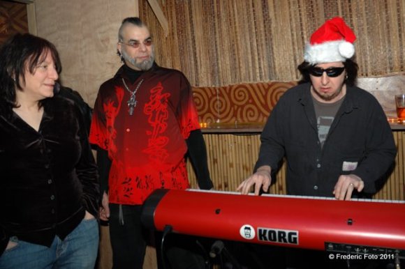 MICHELLE and FATHER VINCENT watch as JOHNNY tickles the ivories!