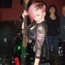 ALISON DIANE of the DOUBLE DOWN SALOON, NYC, holds RUCKUS' Bass while he's off doing ....Something!