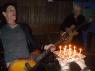 DANNY gets ready to blow out the candles on his cake as KEVIN plays "HAPPY BIRTHDAY"!