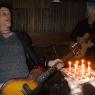 DANNY gets ready to blow out the candles on his cake as KEVIN plays "HAPPY BIRTHDAY"!