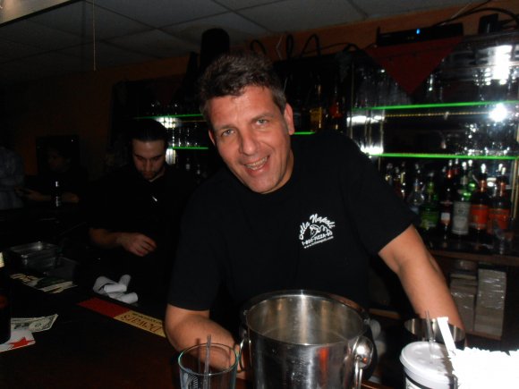 BELLA NAPOLI owner, TONY RUSSO, enjoying the band while Bartender CEASAR works in the background!