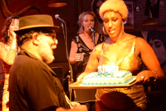 DEANNA and SARA sing HAPPY BIRTHDAY as FRANK prepares to blow out the candles as CYD holds the cake!