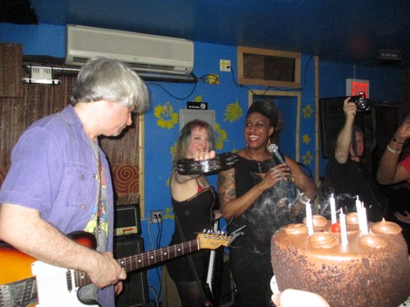 SARAH and CYD watched as Birthday Boy T. J. blew out the candles on his cake!