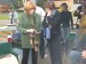 JANE showing off Grandkid's photo to MARTHA!