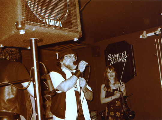 Mr. WOOD introducing ACID RAYZ @ GRAND CENTRAL BAR 4/2/5 with SUSAN MITCHELL looking on.