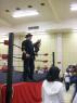 BIG RON & Mr. WOOD watch as LUCIFER steals off with the belt!