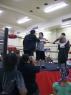 Mr. WOOD talks with the ref while LUCIFER enters the ring.